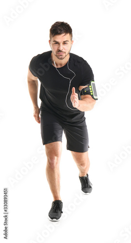 Sporty running young man on white background © Pixel-Shot