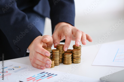 Bank manager with coins on ...