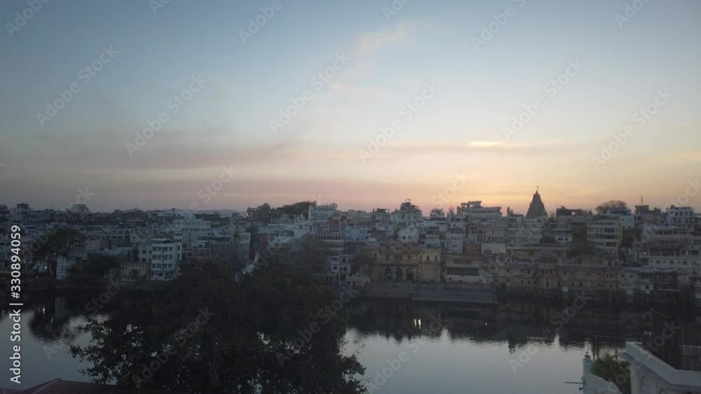 A beautiful sunset hyperlapse of a city in india with a large canal running through. A beautiful sunset hyperlapse of a city in india with a large canal running through.