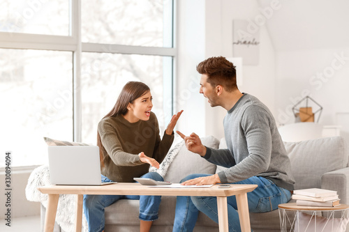 Young couple quarreling at ...