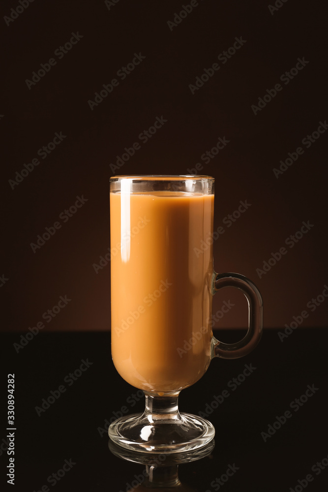 Glass cup of iced coffee on dark background Glass cup of iced coffee on dark background