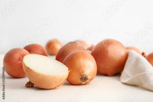 Fresh raw onion on white table