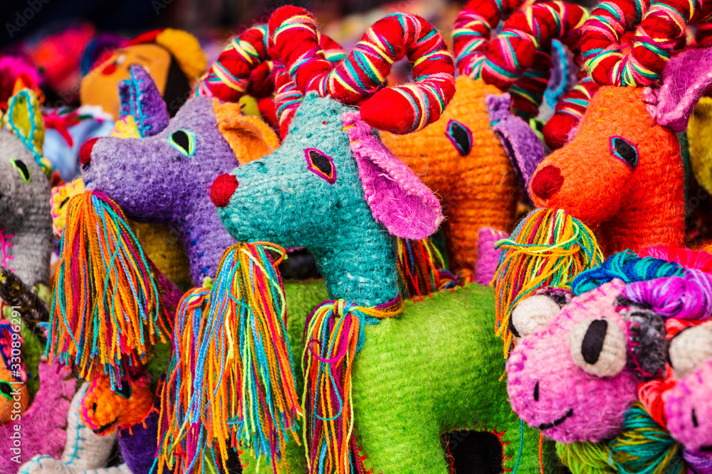 Obraz premium Colorful goats woven by hand in wool in outdoor exhibition. 