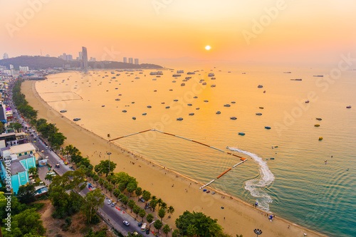 Beautiful tropical beach sea ocean bay with architecture building and ship around pattaya city