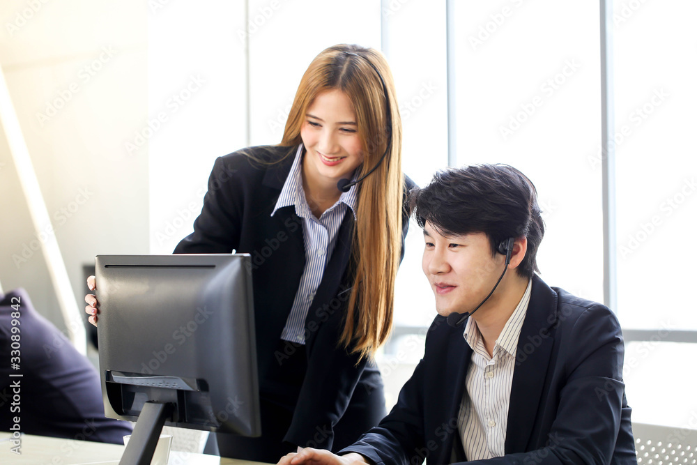 Asia Group of call center workers or Confident business team with headset in office. Asia Group of call center workers or Confident business team with headset in office.