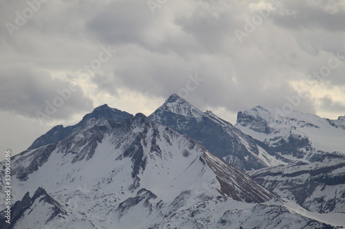 Photography Snowy mountains in the clouds