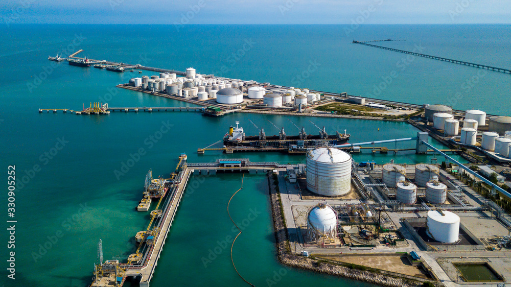 Aerial view tank farm terminal for bulk petroleum and gasoline storage, Crude oil storage fuel petrochemical terminal, Business global oversea commercial distribution petroleum product worldwide.
