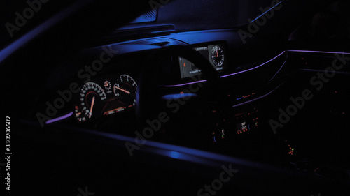 Interior luxury car in color lights and black background