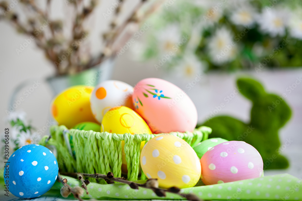 Happy Easter. Congratulatory easter background. Easter eggs and flowers. Background with copy space. Selective focus. Happy Easter. Congratulatory easter background. Easter eggs and flowers. Background with copy space. Selective focus.