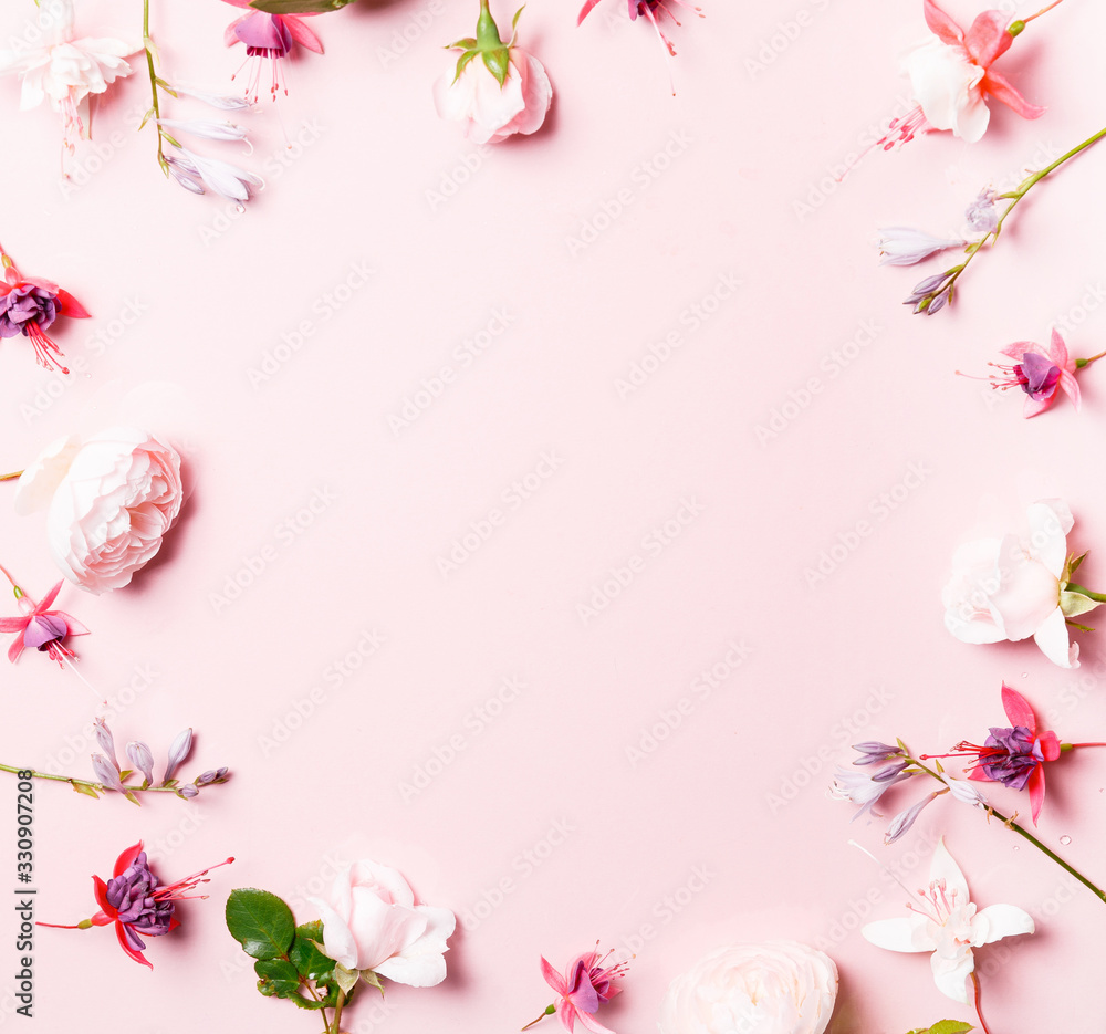 Festive flower composition on the pink background. Overhead view