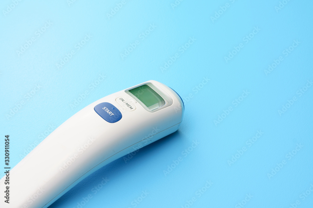 medical concept. corona virus covid-19. thermometer on blue desk. free copy space for your text medical concept. corona virus covid-19. thermometer on blue desk. free copy space for your text