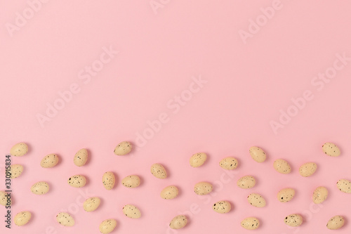 Frame made of easter eggs on a pink pastel background. Holiday creative concept. © rorygezfresh