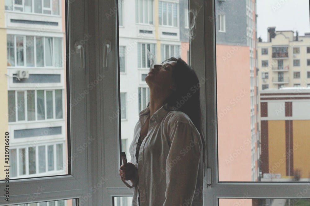 Attractive caucasian brunette girl at home, emotional portrait