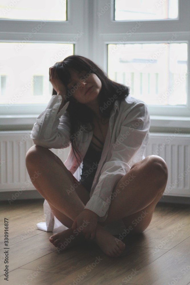 Attractive caucasian brunette girl at home, emotional portrait