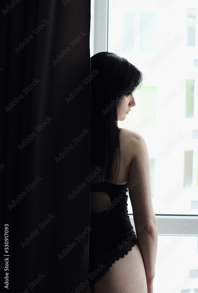 Attractive caucasian brunette girl at home, emotional portrait