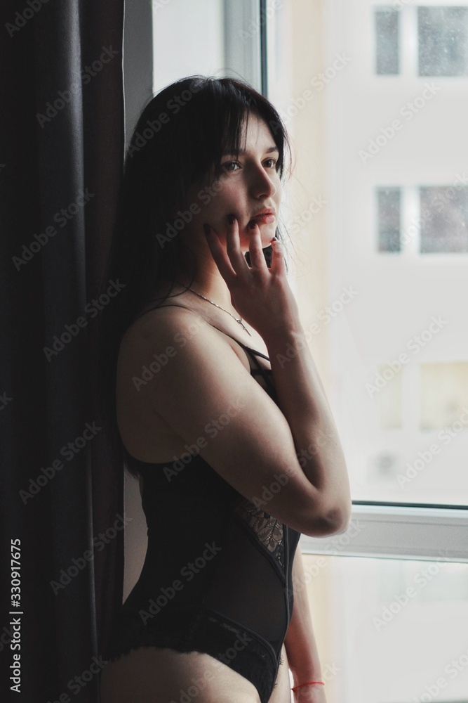 Attractive caucasian brunette girl at home, emotional portrait