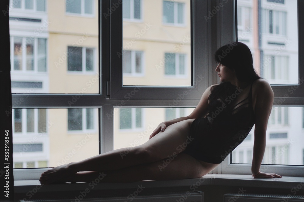 Attractive caucasian brunette girl at home, emotional portrait