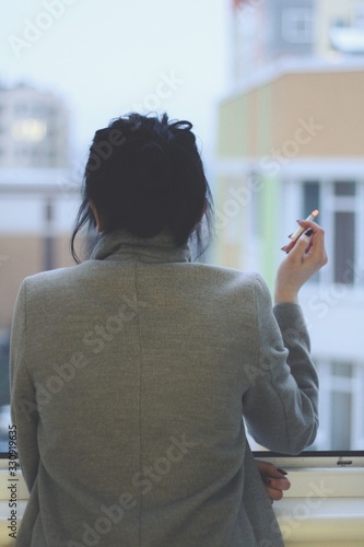 Attractive caucasian brunette girl at home, emotional portrait