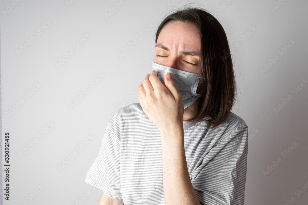 Girl in a medical mask. Medical mask for protection against viruses. Protection of the health of the patient and others. Prevention of the disease. Girl in a medical mask. Medical mask for protection against viruses. Protection of the health of the patient and others. Prevention of the disease.