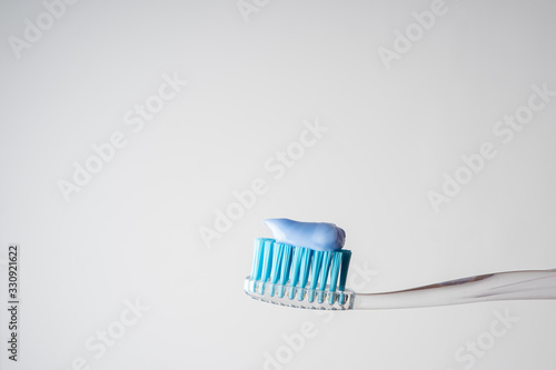 Toothpaste on a toothbrush. Toothbrush. Oral hygiene.