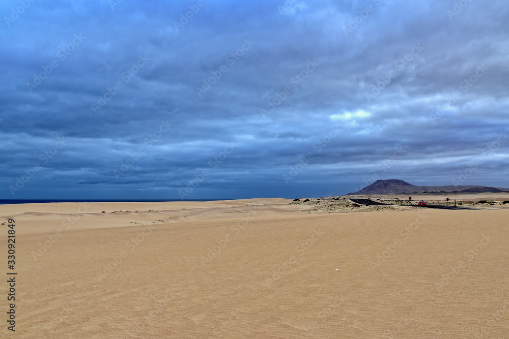 landscape from the Spanish Canary Island Fuerteventura with dunes and the ocean
