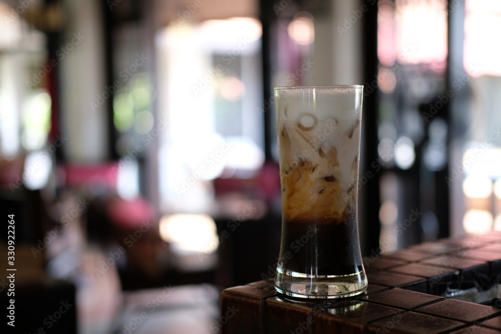 Iced coffee with milk on table Iced coffee with milk on table