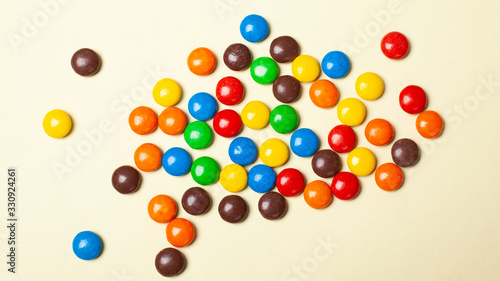 small multi-colored sweets. colorful candies top view.