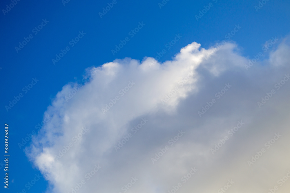 Bright white with grey clouds on blue sky. Bright white with grey clouds on blue sky.