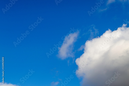 Bright white clouds on blue sky. Beautiful background.