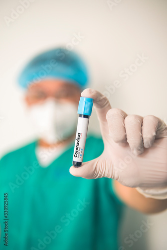 Coronavirus 2019-nCoV Blood Sample. Corona virus outbreaking. Corona Virus in Lab. Scientist hold a tube with Blood Test and Barcode with the Virus Name Coronavirus . New Epidemic Corona Virus