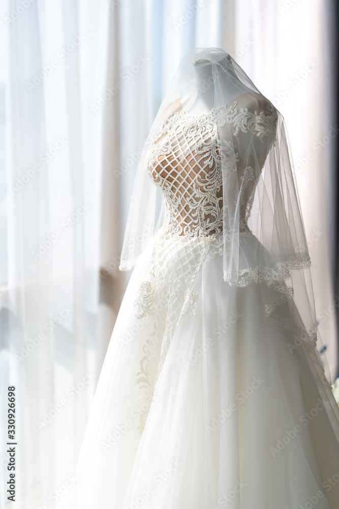 wedding dress on a mannequin in panorama window. wedding dress on a mannequin in panorama window.