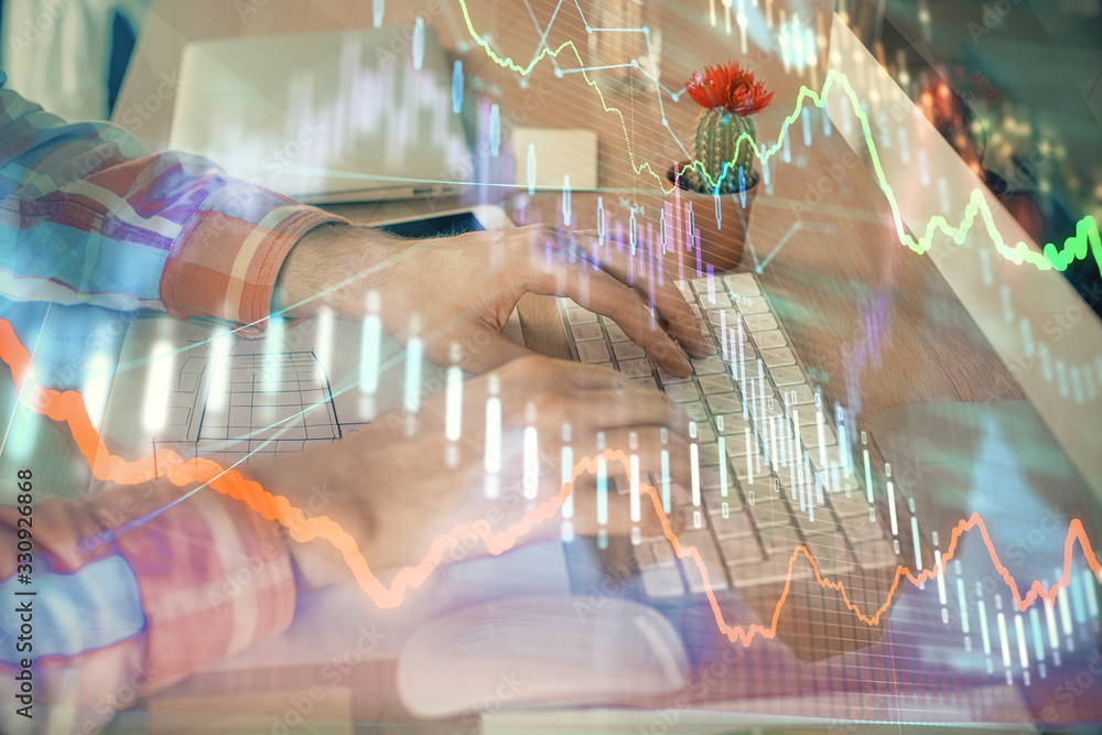 Double exposure of stock market chart with man working on computer on background. Concept of financial analysis. Double exposure of stock market chart with man working on computer on background. Concept of financial analysis.