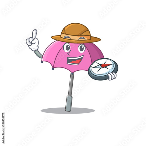 Pink umbrella an experienced explorer with a compass