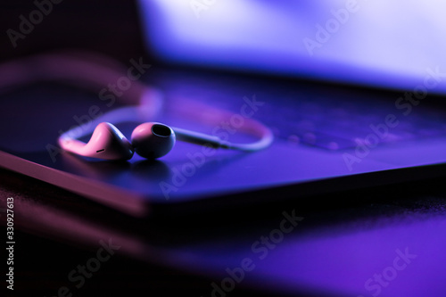 colorful close-up of handsfree on a laptop keyboard with super shallow depth of field