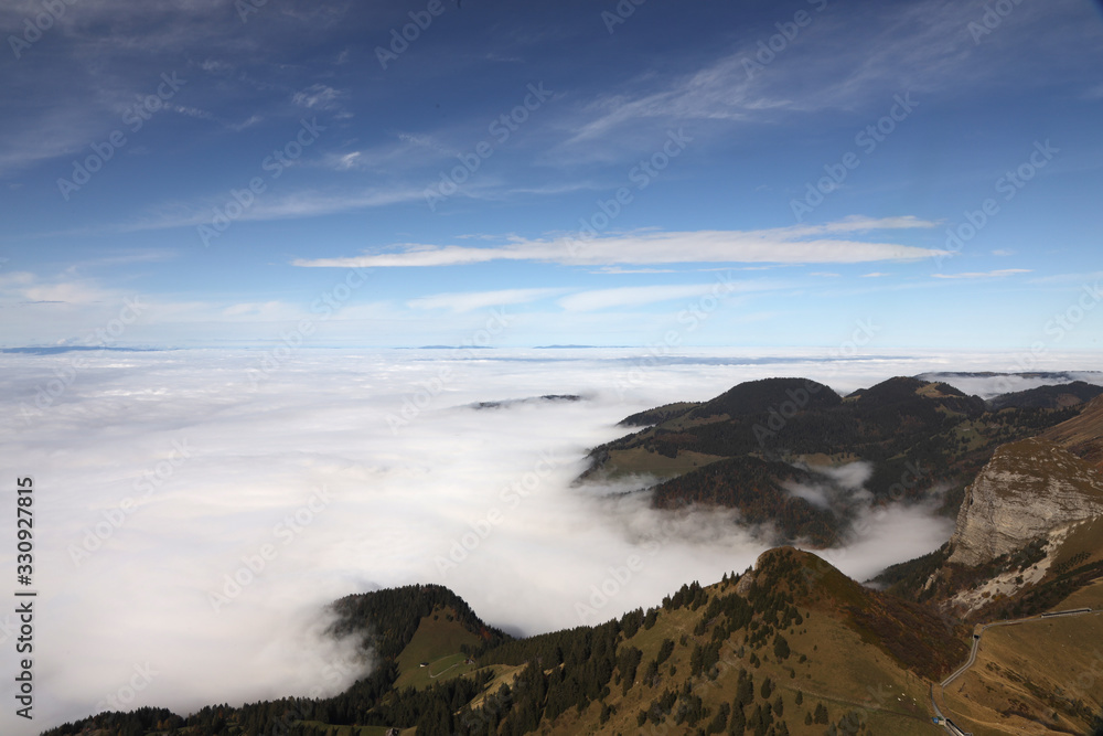 Swiss hills with a sea of clouds