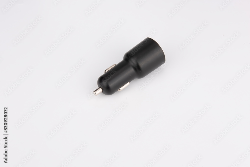USB car adapter, phone charger on white background USB car adapter, phone charger on white background