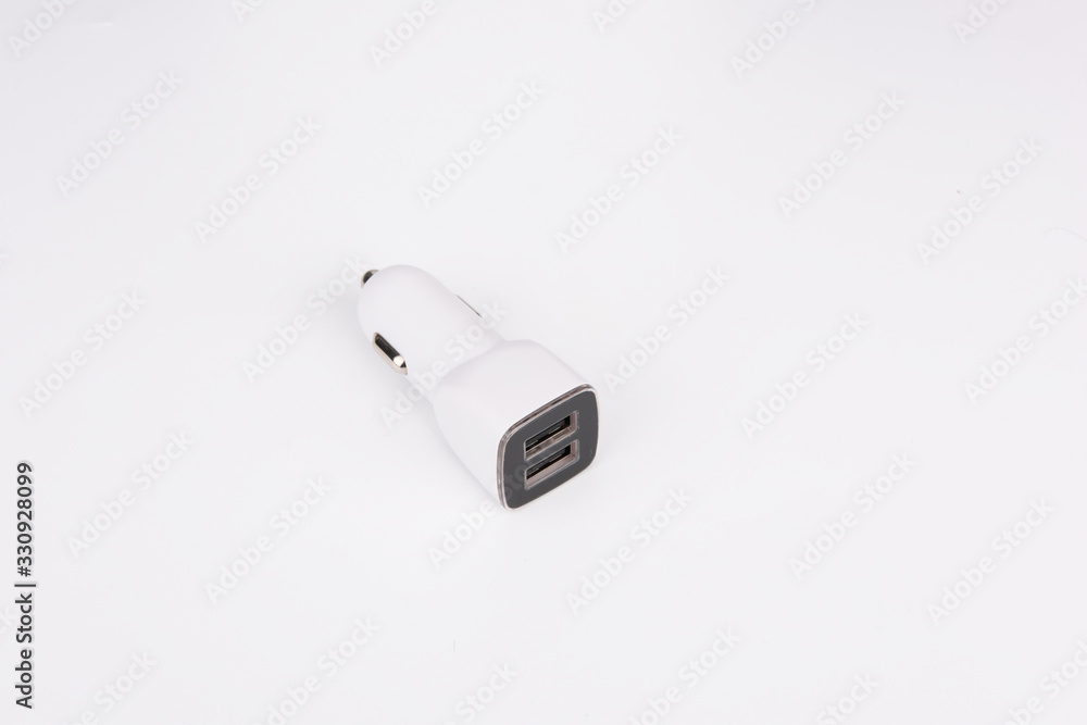 USB car adapter, phone charger on white background USB car adapter, phone charger on white background