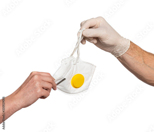  Doctor giving mask to a patient for protection against viruses and infections over white background