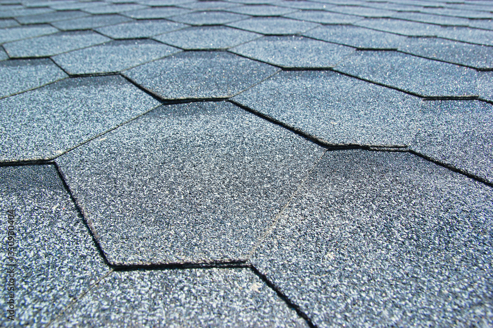 Obraz premium Gray soft roof on the roof of the house. Close-up.