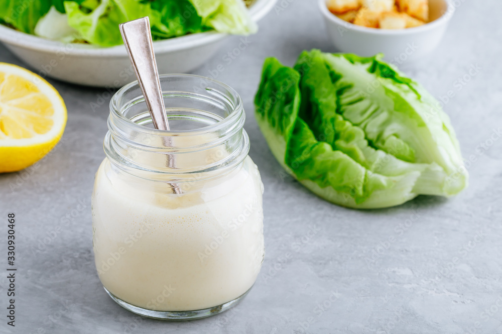 Homemade Caesar Salad Dressing in glass jar Homemade Caesar Salad Dressing in glass jar
