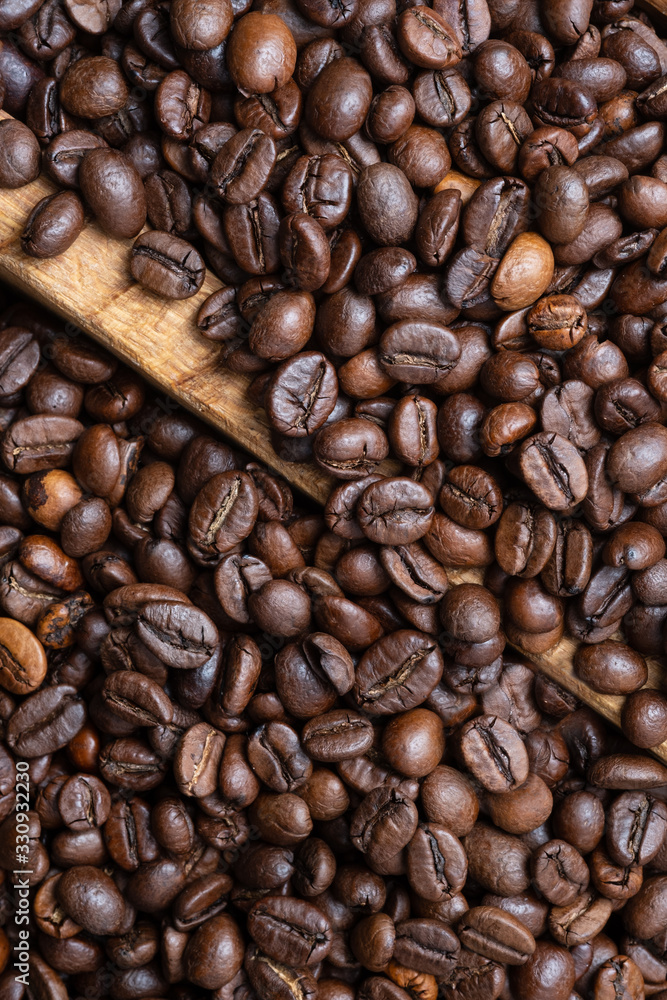 Fototapeta premium Roasted coffee bean background, top view