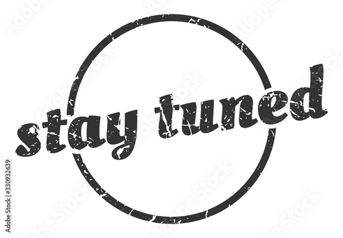 stay tuned sign. stay tuned round vintage grunge stamp. stay tuned