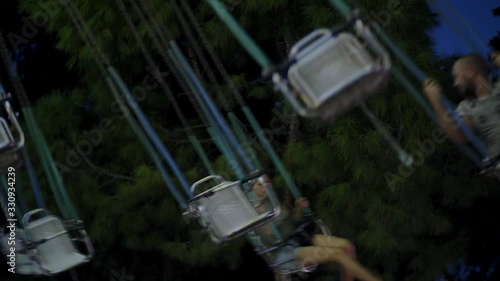 people are enjoying on rotating swing at lunapark 