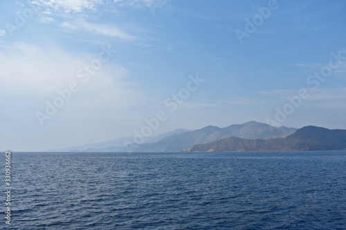 silhouettes of mountains on the Aegean sea. © Igor