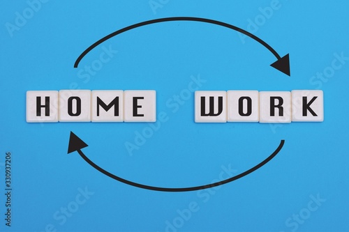 Home or work, work from home words and arrow concept on vibrant blue background. 