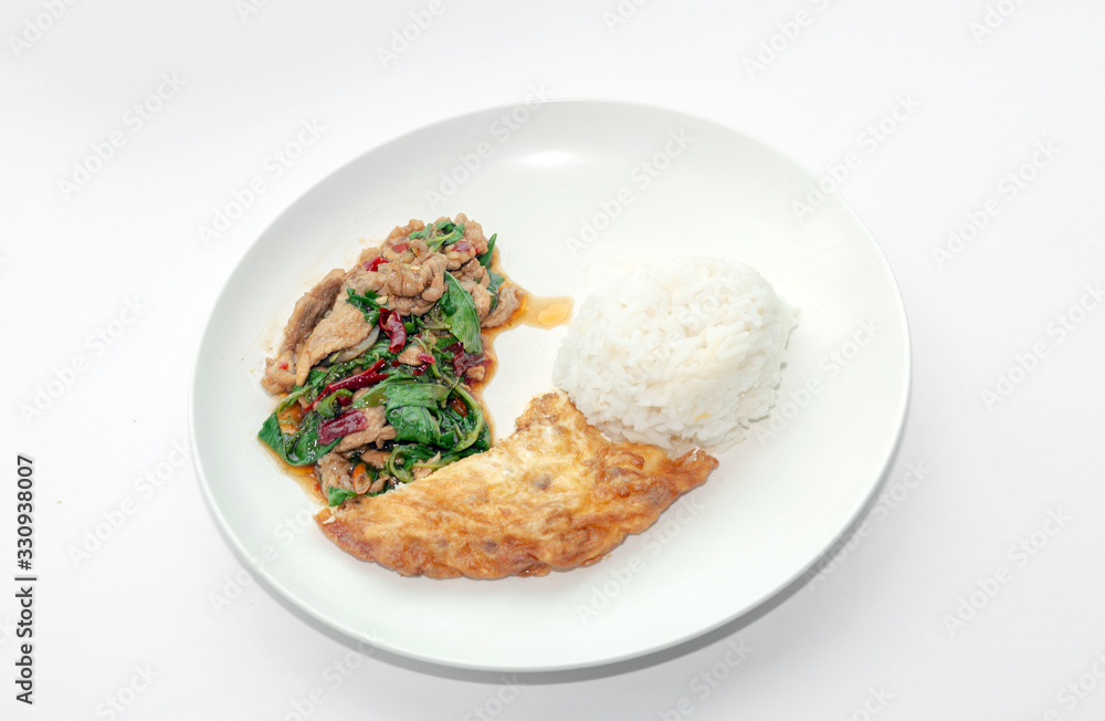 Thai food menu with spicy basil fried with pork and serve with omlet egg Thai food menu with spicy basil fried with pork and serve with omlet egg
