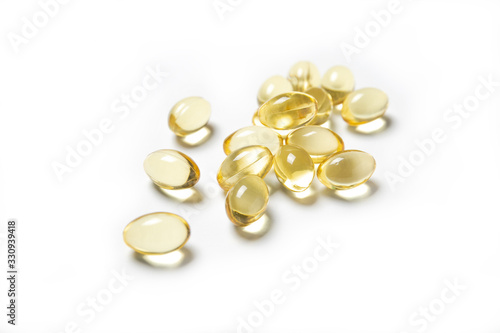Fish oil capsules on a white background. Nutritional supplements