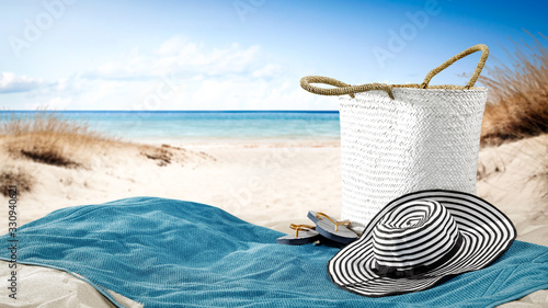 Fototapeta Naklejka Na Ścianę i Meble -  Summer towel on beach and free space for your decoration. 