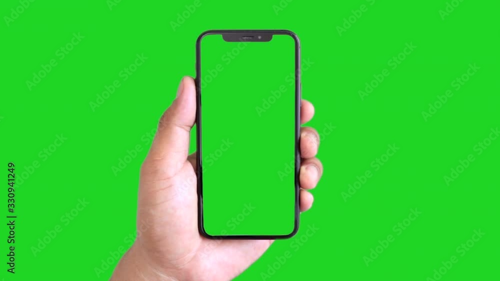 Man's hand holding a black smartphone with green screen and touching or press display, Man using mobile phone with chroma key touch display on green background. Man's hand holding a black smartphone with green screen and touching or press display, Man using mobile phone with chroma key touch display on green background.