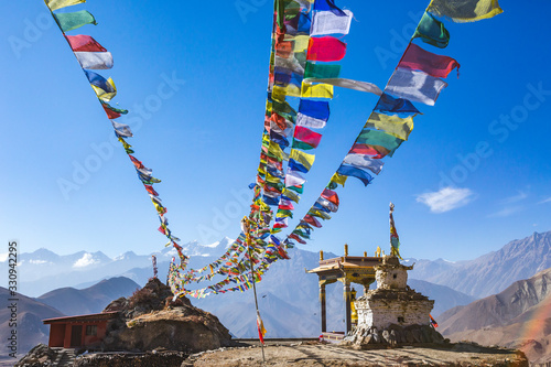 Obraz na płótnie Gompa and Multicolored Buddhist flags in Muktinatn, Nepal